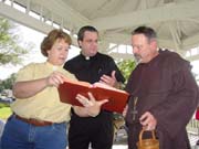 Barb, Gabe and Mac planning out the service