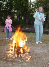 Girl Scouts lighting the fire