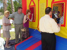 Parents watching the moon bounce