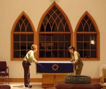 Altar Guild straightens up after worship