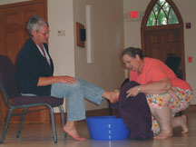 Elaine washes June's feet