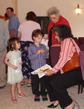 Elisa and Max speak with Ruth and Gina