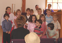 The Children's Church group sings for the congregation