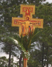 The processional cross with palms on it