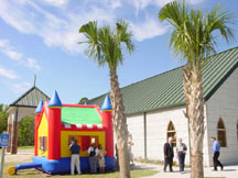 The moon bounce alongside the church building