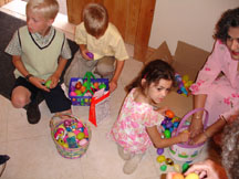 Kids sorting out the contents of their eggs