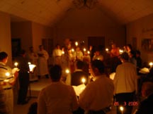 gathered around the baptismal font in the entry hall